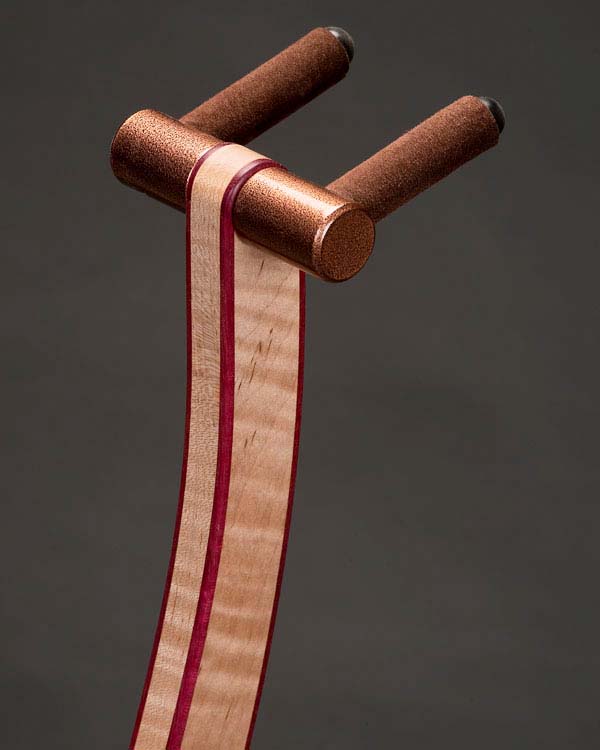 Curly maple with purpleheart edge binding. Copper powdercoating.