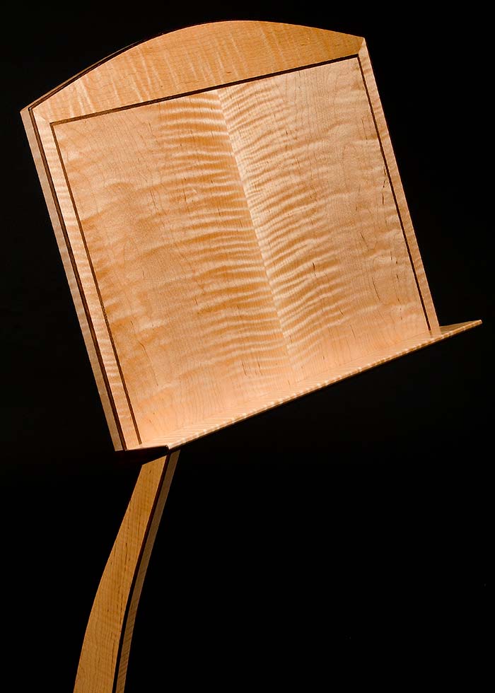 Curly maple music holder with ebony edge binding and inlay.